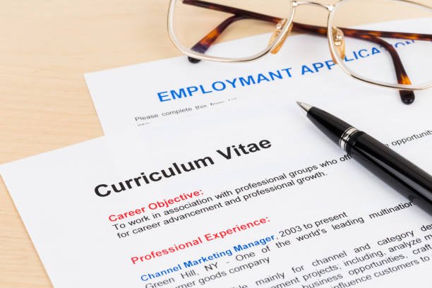 curriculum vitae and employment application form with glasses